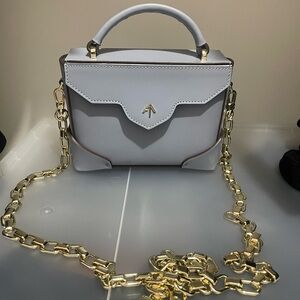 Manu Atelier Micro Bold Bag in Ice Blue with golden chain strap